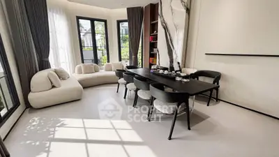 Elegant modern living room with large windows and stylish furniture