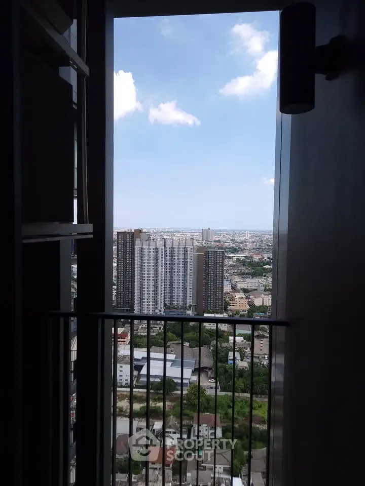 Stunning high-rise city view from a modern apartment balcony, perfect for urban living.