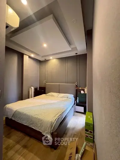 Cozy modern bedroom with stylish ceiling design and ambient lighting
