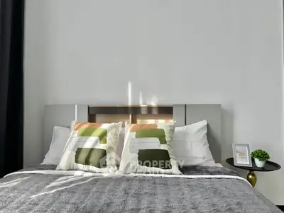 Modern bedroom with stylish decor and cozy bedding, perfect for relaxation and comfort.