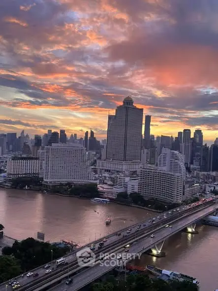 Stunning cityscape view with river and skyscrapers at sunset, perfect for urban living enthusiasts.