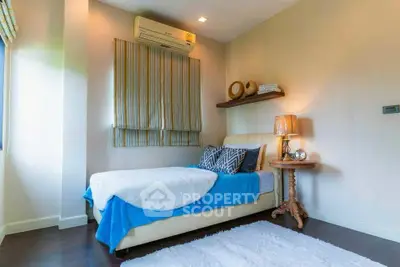 Cozy bedroom with modern decor and natural light