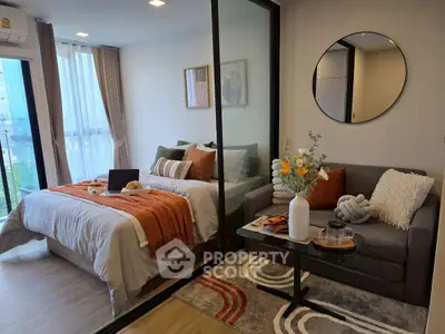 Modern studio apartment with cozy bedroom and stylish living area