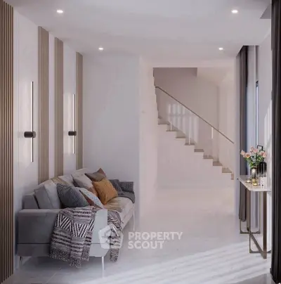 Modern living room with stylish decor and staircase, featuring cozy sofa and elegant lighting.