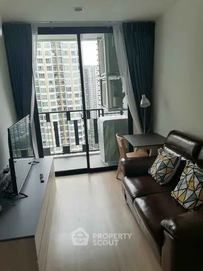 Modern living room with balcony view in high-rise apartment