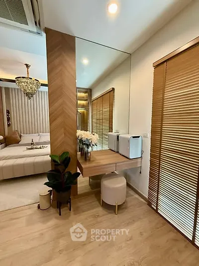 Luxurious bedroom with elegant decor and mirrored wall accent
