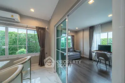 Modern living room with large windows and stylish decor