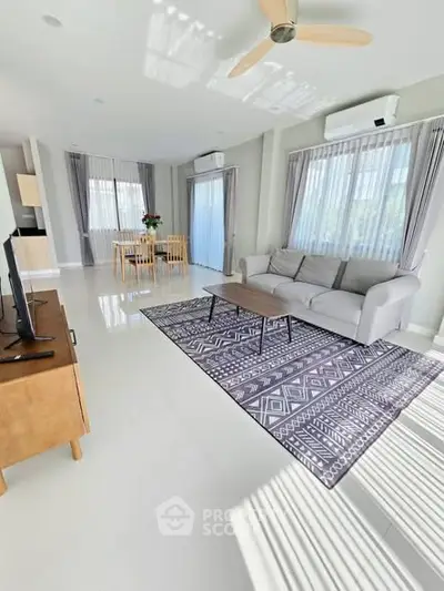 Spacious modern living room with stylish decor and natural light