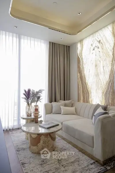Luxurious living room with elegant marble accent wall and plush sofa, perfect for sophisticated urban living.