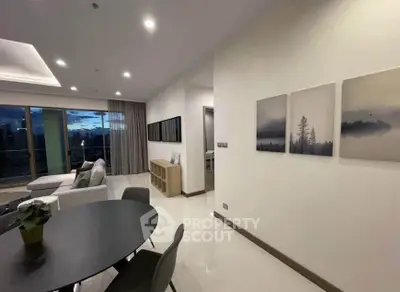 Modern living room with elegant decor and large windows offering stunning views.