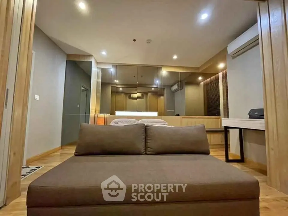 Spacious modern living room with sleek design and cozy seating area