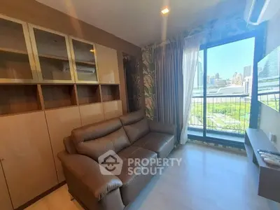 Modern living room with city view, featuring sleek brown sofa and built-in storage cabinets.