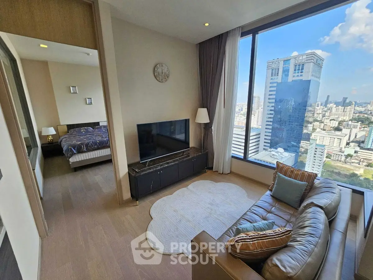 Luxurious high-rise apartment with stunning city view, modern living room and cozy bedroom.