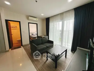 Modern living room with balcony access in a stylish apartment