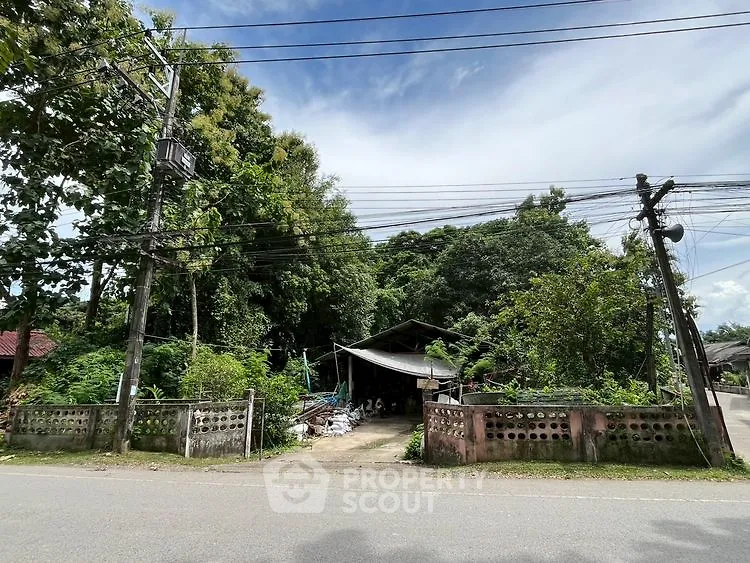 Charming rural property with lush greenery and rustic appeal, perfect for nature lovers.