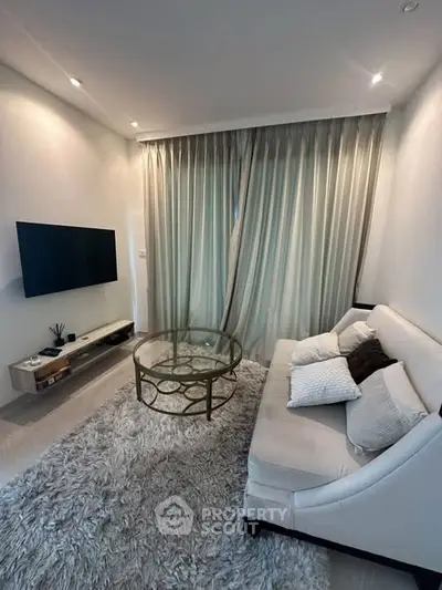 Cozy modern living room with elegant decor and plush furnishings