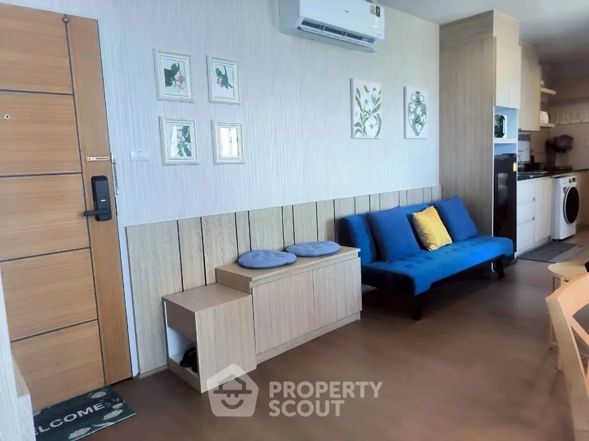 Modern living room with stylish decor and open kitchen layout