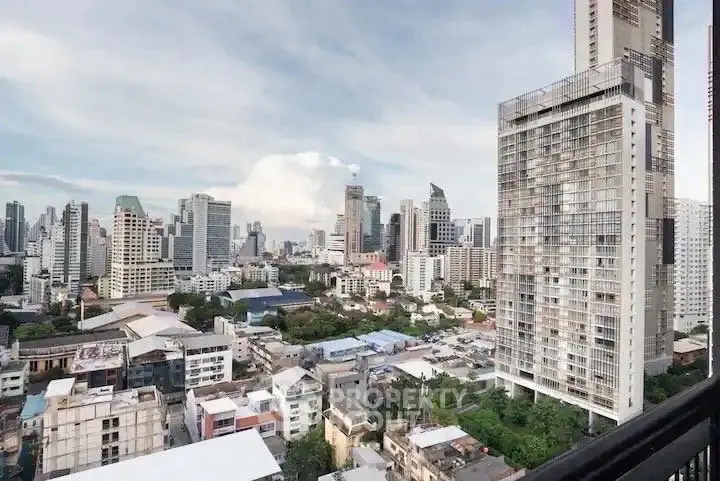 Stunning cityscape view from high-rise apartment balcony in urban skyline.