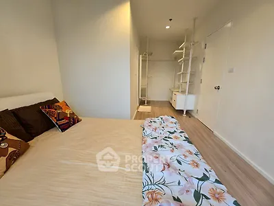 Cozy bedroom with modern decor and ample natural light