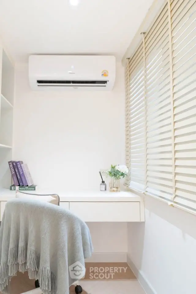 Cozy study room with air conditioning and natural light, perfect for productivity.