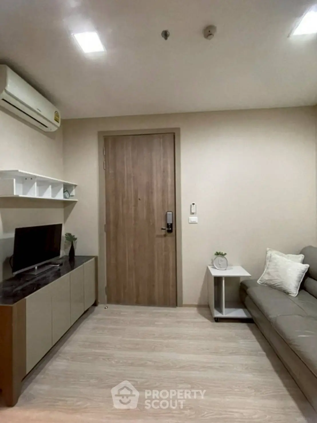 Modern living room with sleek furniture and air conditioning