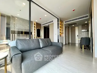 Modern open-plan living room with sleek kitchen and stylish decor