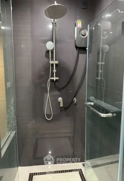 Modern bathroom shower with glass enclosure and sleek fixtures