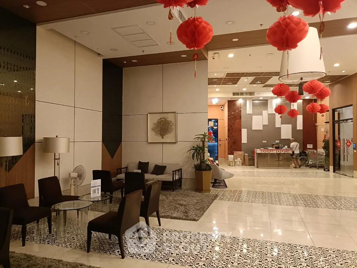 Elegant hotel lobby with modern decor and red lanterns