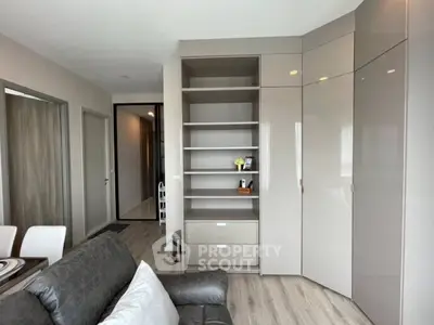 Modern living room with sleek storage cabinets and stylish decor