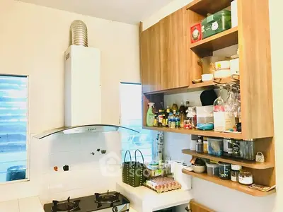 Cozy kitchen with gas stove and ample storage space