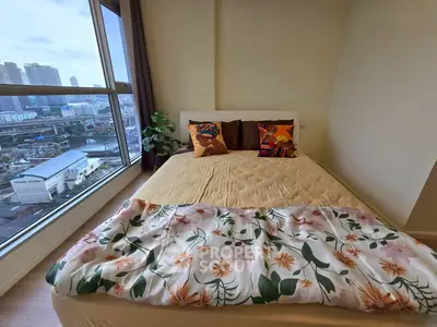 Cozy bedroom with city view and stylish decor in modern apartment