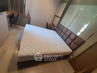 Modern bedroom with stylish decor and comfortable bed in a cozy apartment.