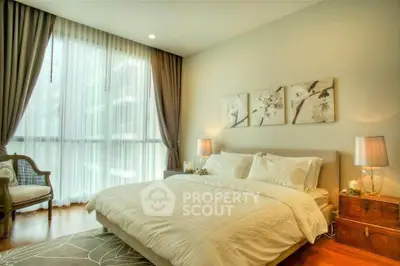 Luxurious bedroom with elegant decor and large window in modern apartment