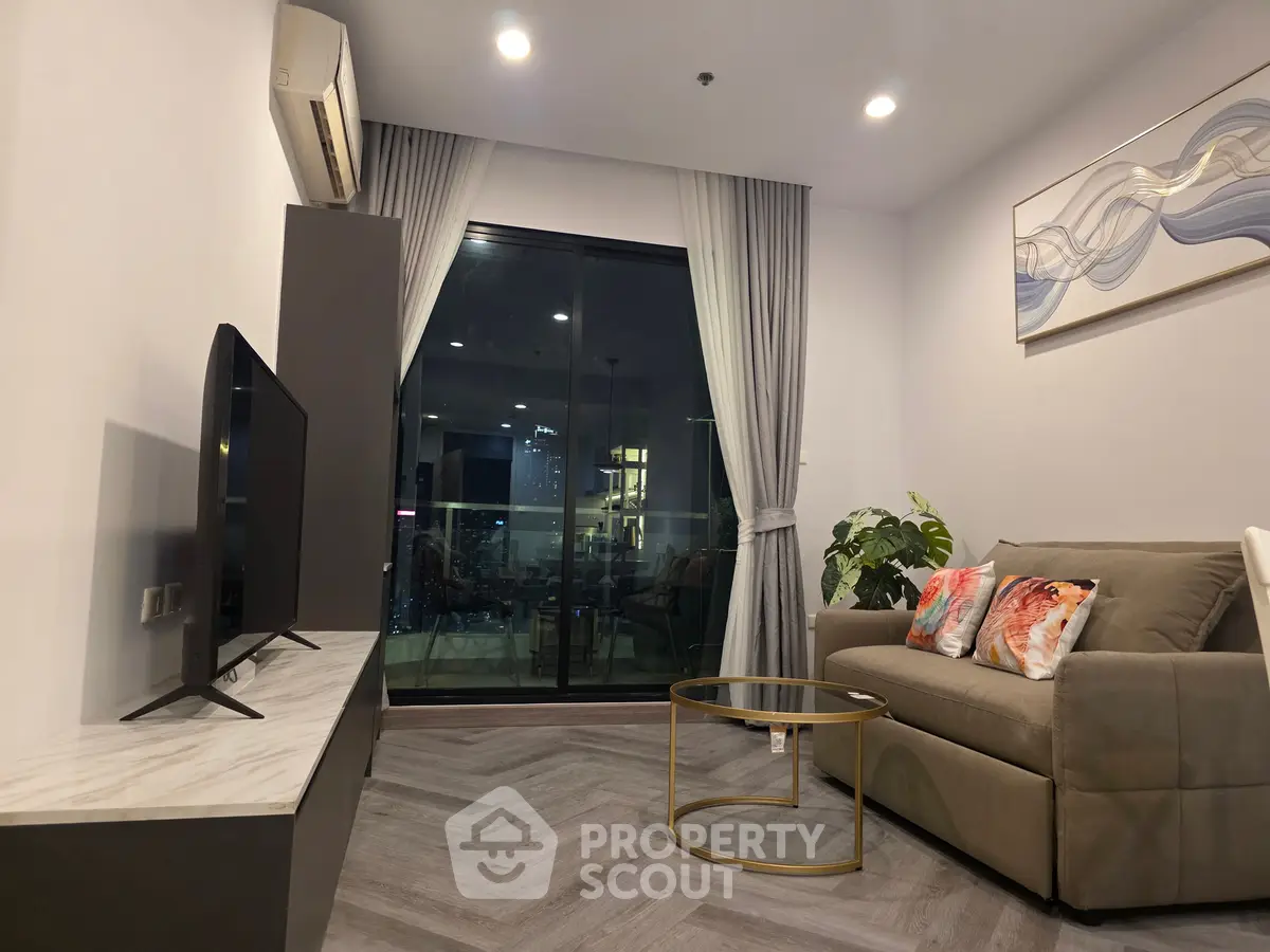 Modern living room with stylish decor and large window view