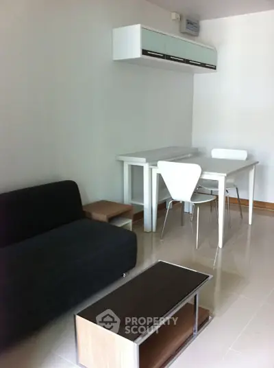 Modern minimalist living room with sleek furniture and dining area