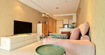 Spacious living room with modern decor and open kitchen layout