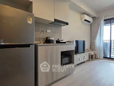 Modern kitchen with sleek appliances and open layout in a stylish apartment