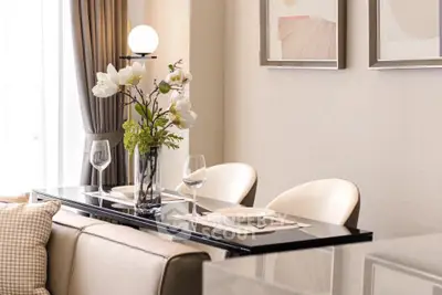 Elegant dining area with modern decor and stylish table setting in a cozy apartment.