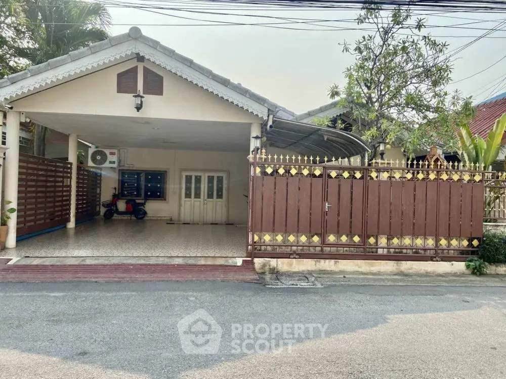 Charming single-story home with gated entrance and covered parking in a serene neighborhood.