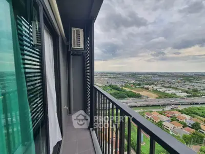 Stunning high-rise balcony with panoramic city and landscape views, perfect for relaxation and enjoying sunsets.