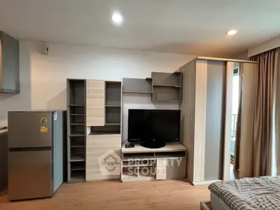Modern living room with sleek wooden furniture and flat-screen TV, perfect for contemporary urban living.