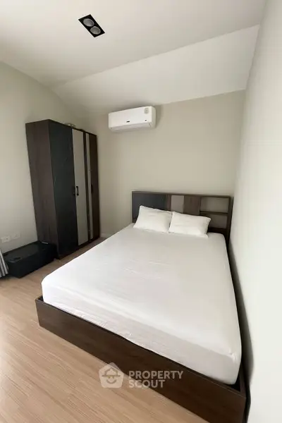 Modern bedroom with minimalist design and air conditioning