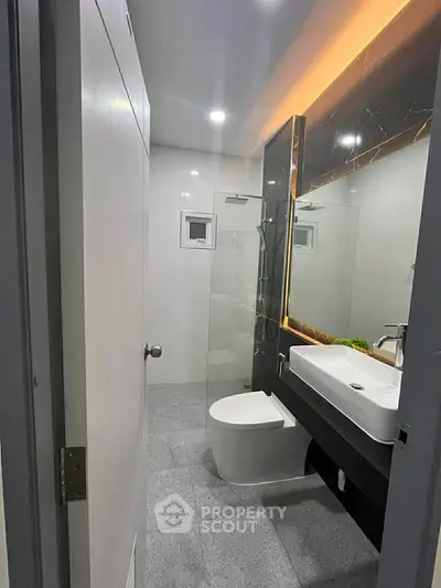 Modern bathroom with sleek fixtures and ambient lighting