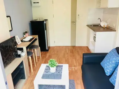 Cozy modern living room with compact kitchen and stylish decor