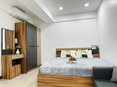 Modern bedroom with stylish wooden furniture and cozy ambiance