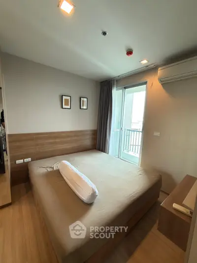 Modern bedroom with balcony access in a stylish apartment