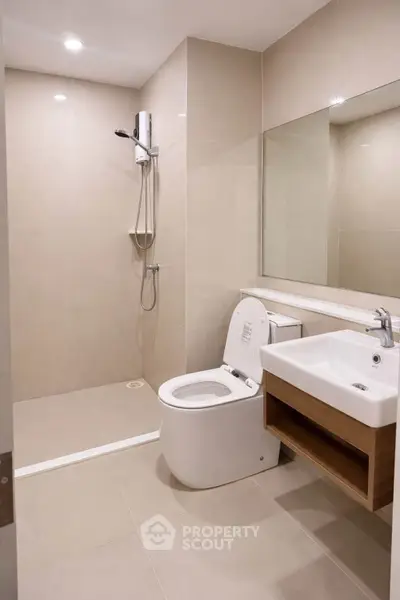 Modern bathroom with sleek fixtures and spacious shower area