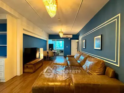 Luxurious living room with elegant blue walls and leather sofa