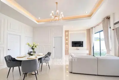 Luxurious living room with elegant chandelier and modern decor