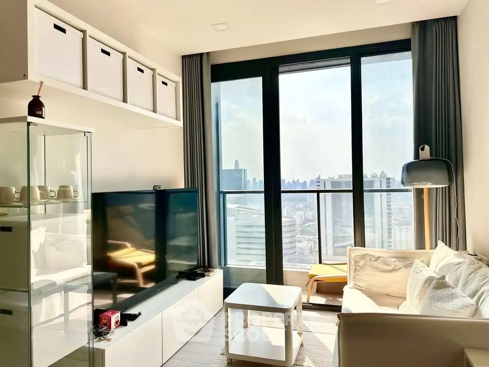 Bright modern living room with large windows and city view, featuring cozy seating and stylish decor.